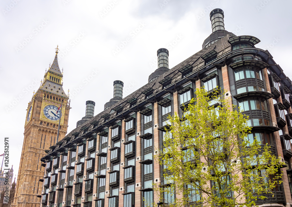 Big Ben tower and Portcullis house on Victoria embankment in London, UK