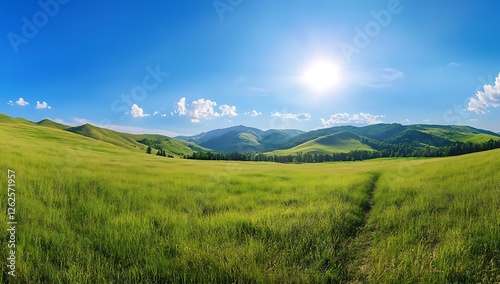 Vast Green Expanse A panoramic view of a lush green landscape with rolling hills and a bright blue sky dotted with fluffy white clouds creating a sense of peace and tranquility
