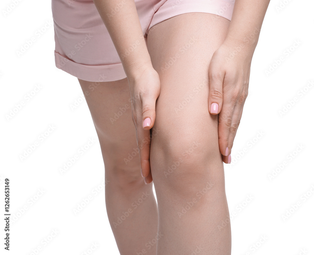 Young woman suffering from pain in knee on white background, closeup Young woman suffering from pain in knee on white background, closeup