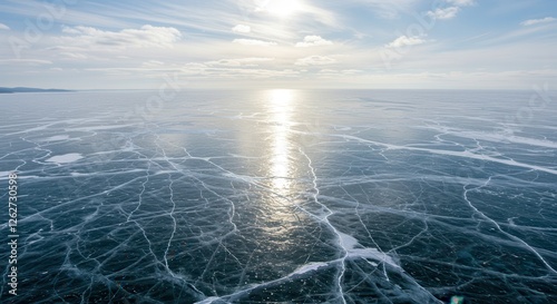 Frozen Lake Baikal Ice Surface with Cracks and Winter Sunlight