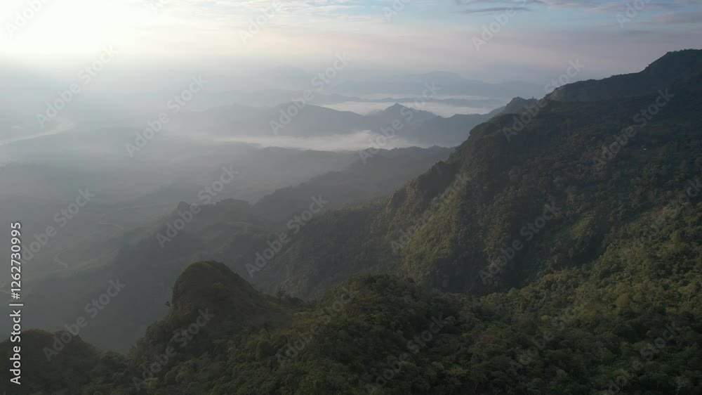 Aerial landscape view of the mountain range on foggy day by drone Aerial landscape view of the mountain range on foggy day by drone