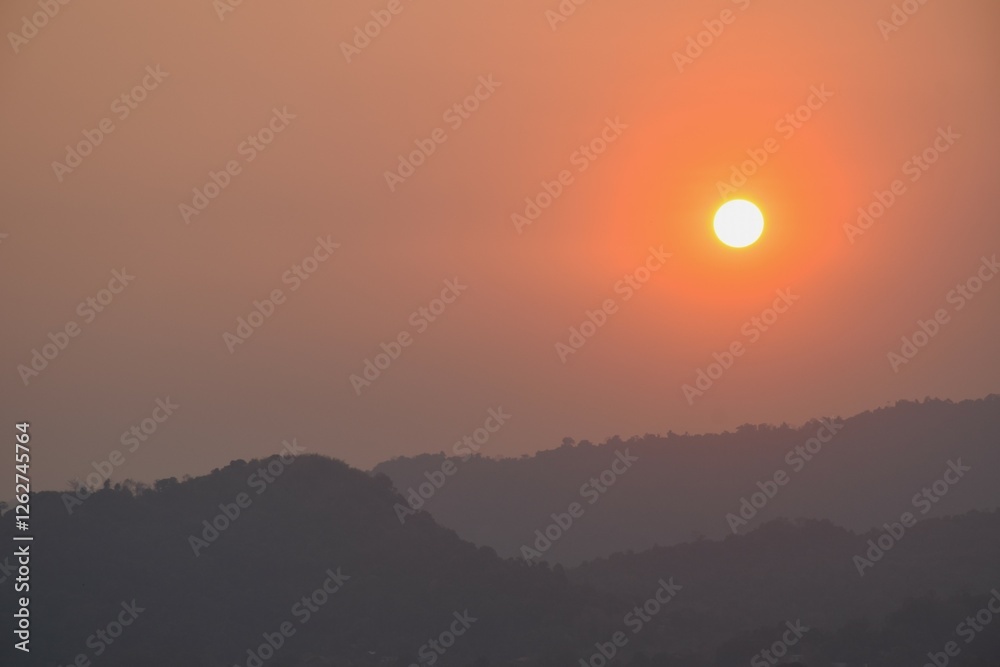 sunset into mountain at Khun Dan Prakarn Chon huge concrete dam in evening on Thailand sunset into mountain at Khun Dan Prakarn Chon huge concrete dam in evening on Thailand