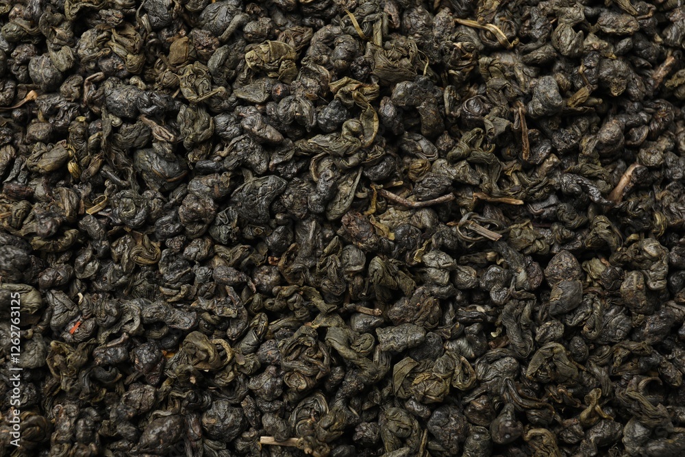 Pile of dry tea leaves as background, top view Pile of dry tea leaves as background, top view