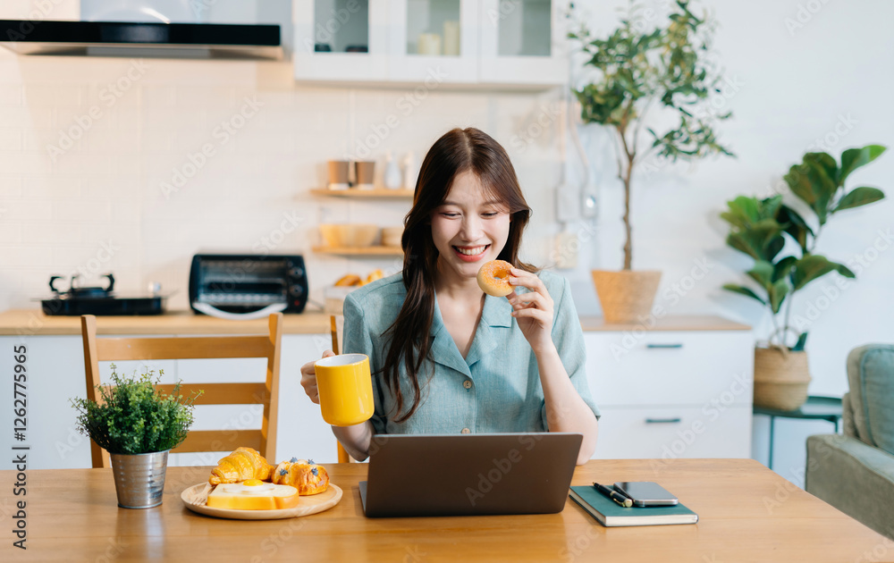 Woman sits in a office working on smartphone and laptop play social media and enjoys a coffee. Woman sits in a office working on smartphone and laptop play social media and enjoys a coffee.