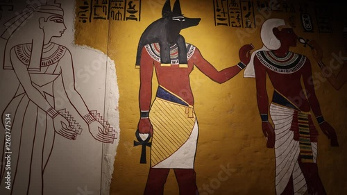 A detailed ancient Egyptian tomb painting depicting Anubis, the god of mummification and the afterlife. The vibrant colors and precise hieroglyphs highlight the sacred burial rituals.