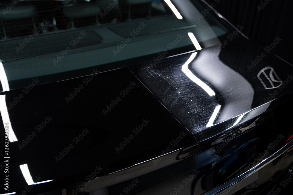 Spectacular before-and-after paint correction reveals swirl removal on the right and a flawless mirror finish on the left