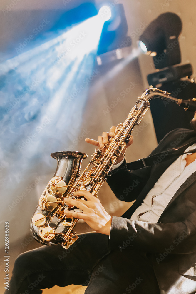 Obraz premium Man plays saxophone, classical jezz music, concert