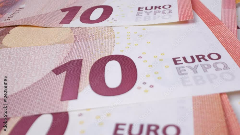 Vilnius, Lithuania – February 15, 2025. Extreme close-up shot of 50 euro banknotes with a sliding motion Vilnius, Lithuania – February 15, 2025. Extreme close-up shot of 50 euro banknotes with a sliding motion