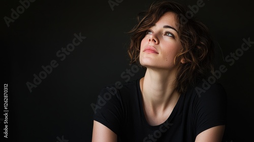 Portrait of Individual with Refined Features and Thoughtful Expression