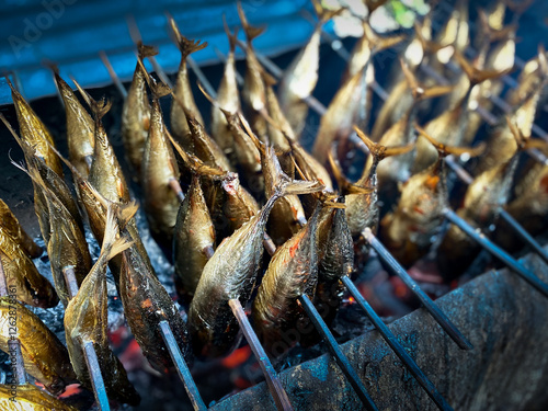 Fototapeta smoked fish on display by fishermen