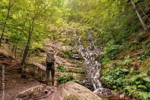 Obraz na płótnie Woman Tourist Hiking in Mountain Forest with Waterfall w salonie