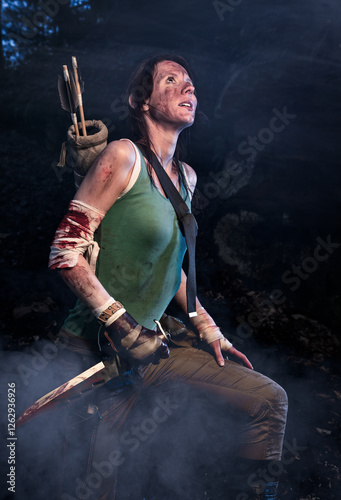 Moody Portrait of a warrior with knife scouting terrain