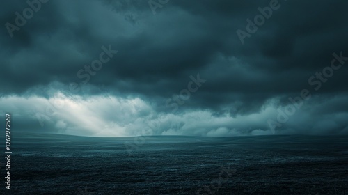 Dark Stormy Sea Under Dramatic Clouds with Soft Light Breaking Through
