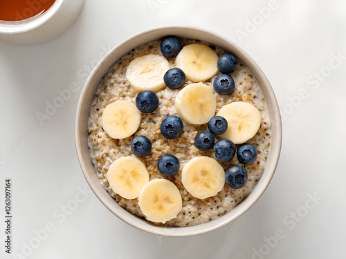  Healthy cereal options Nutritious quinoa oatmeal with banana and blueberries, healthy breakfast, high-fiber whole grains, superfood meal, weight-loss friendly, vegetarian diet, wholesome eating, food photo