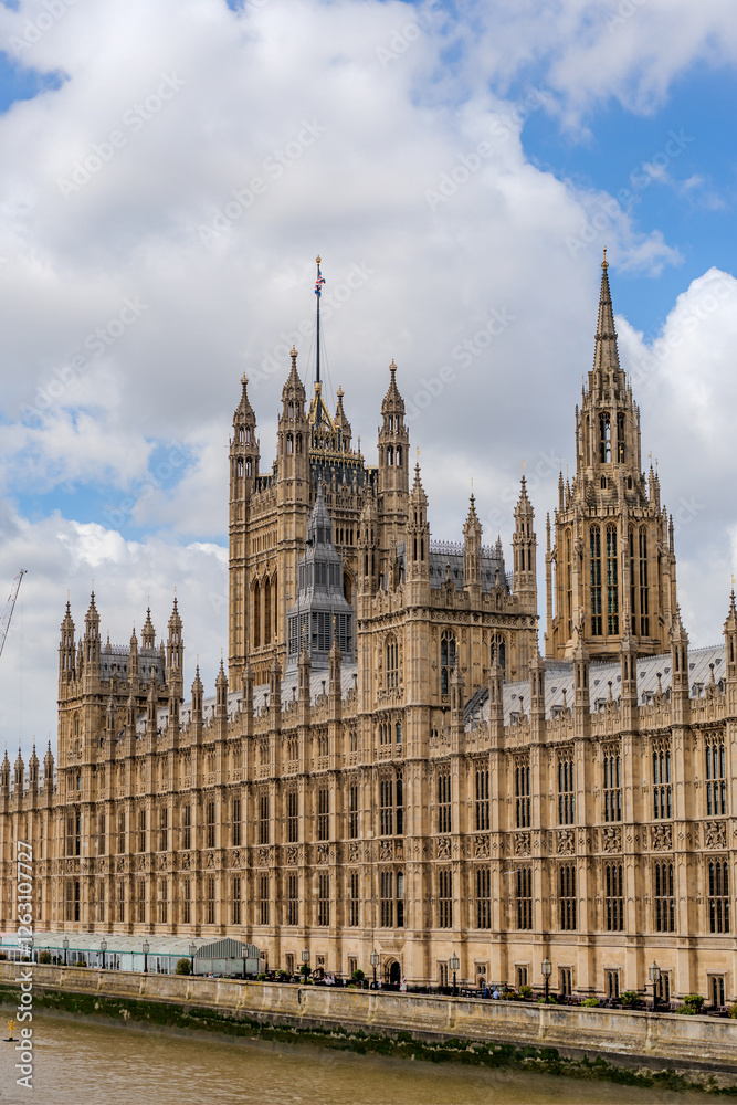 the iconic Palace of Westminster, home to the UK Parliament, with its intricate Gothic architecture along the River Thames. the iconic Palace of Westminster, home to the UK Parliament, with its intricate Gothic architecture along the River Thames.