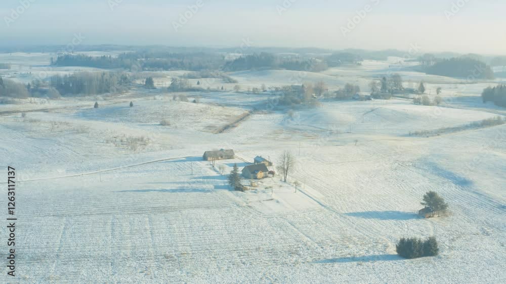 Winter snow covered farm, aerial drone view, farmstead house in fields Winter snow covered farm, aerial drone view, farmstead house in fields