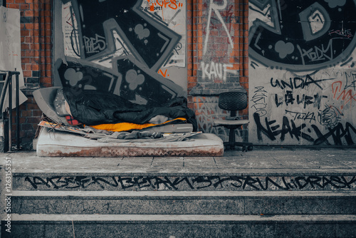 Urban Survival, Homeless Bed Amid Graffiti and Rubble, homelessness, germany, berlin photo