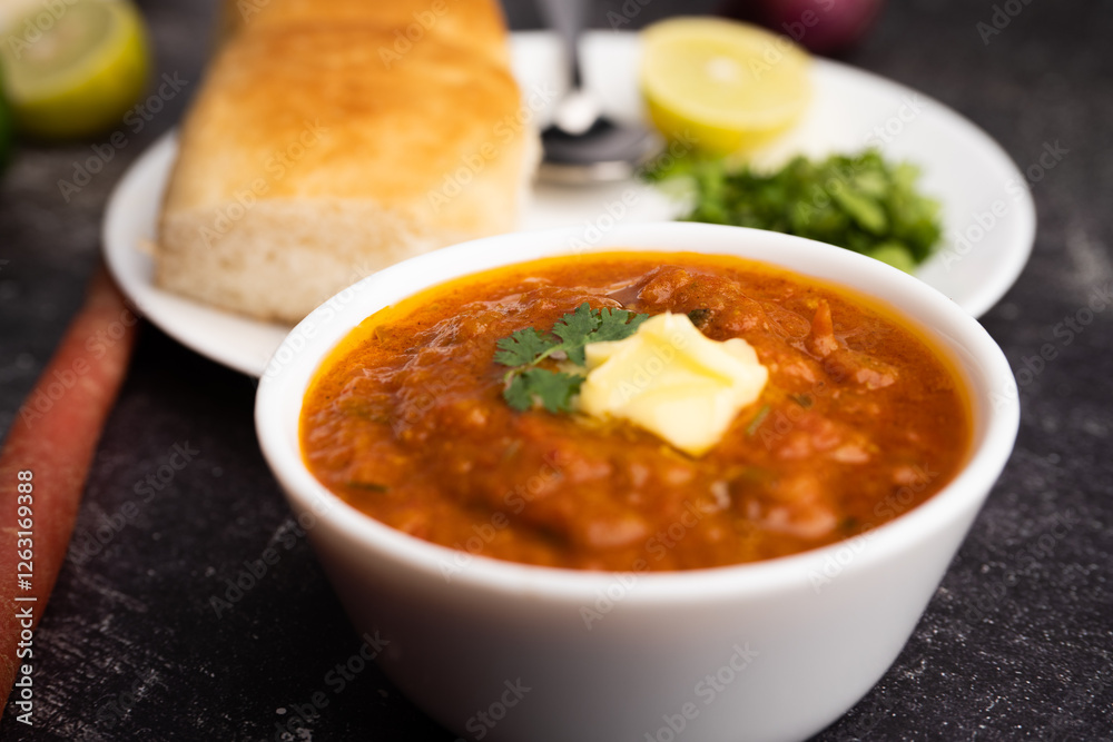 Pav bhaji is a fast food dish from India consisting of a thick vegetable curry served with a soft bread roll Pav bhaji is a fast food dish from India consisting of a thick vegetable curry served with a soft bread roll