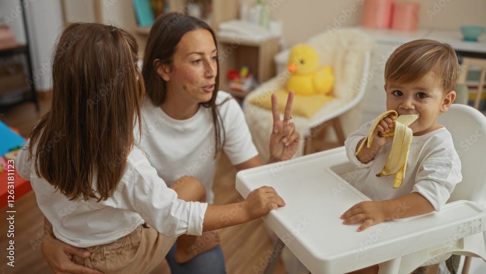 Woman with daughter and son in living room enjoying family time together while boy eats banana in cozy apartment setting. Woman with daughter and son in living room enjoying family time together while boy eats banana in cozy apartment setting.
