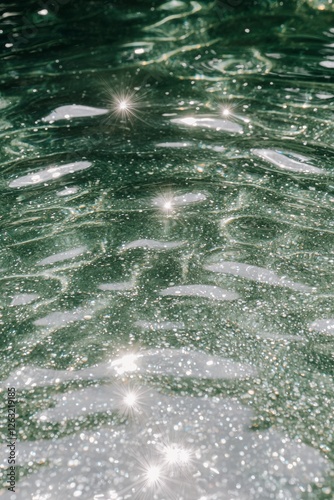 Obraz na płótnie Sunlight sparkling on green water ripples creating mesmerizing patterns - aesthetic faceless content for social media instagram pinterest marketing, minimalist wallpaper background w salonie