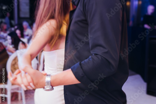 High school graduates dancing on prom, waltz and classical ball slow dance in dresses and suits on school graduation party, boys and girls ballroom dancers, couples dance quadrille and polonaise photo