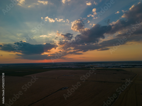 Residential neighborhood seen from above. Lots of houses in a field at sunset. Human settlements on the outskirts of the city 4k