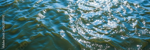 Swirling river waters exhibit mesmerizing iridescent patterns created by sunlight interaction with water surface, aquatic, reflections, shimmering
