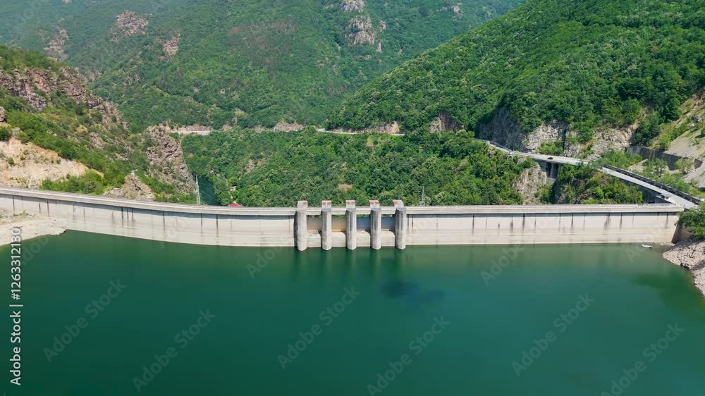 Hydroelectric dam retaining water in artificial lake Hydroelectric dam retaining water in artificial lake