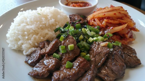 Delicious Bulgogi dish from South Korea, savory grilled beef with steamed rice and kimchi, vibrant colors, cultural cuisine photo