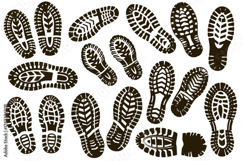 Many black shoe prints are showing different boot and shoe soles with visible treads, ideal for representing hiking or trekking or any outdoor activity