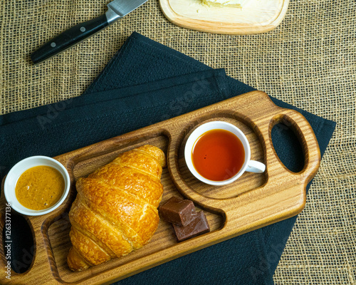 breakfast with croissant and hot maracan tea