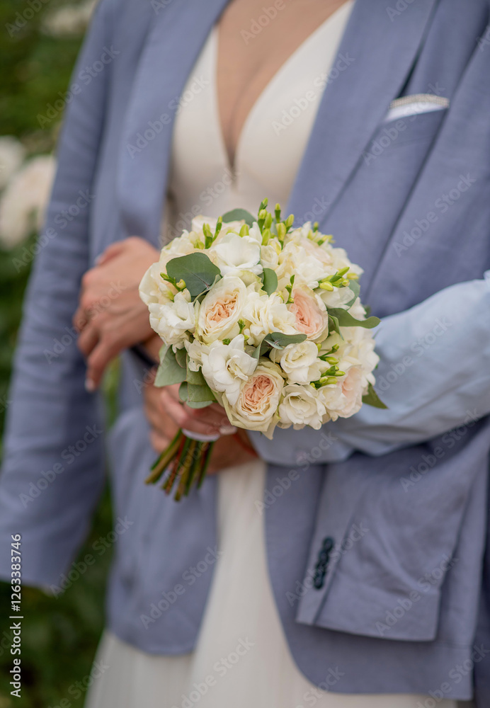 Bride in blue blazer holding wedding bouquet Bride in blue blazer holding wedding bouquet