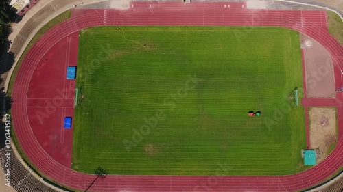 Lawn mower on a soccer field - aerial view