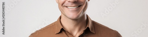 A happy man with a big smile on his face, suitable for use in ads, posters or social media photo