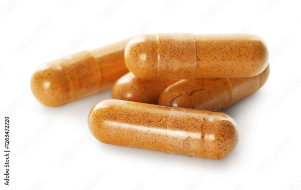 Many turmeric capsules isolated on white. Herbal dietary supplement Many turmeric capsules isolated on white. Herbal dietary supplement