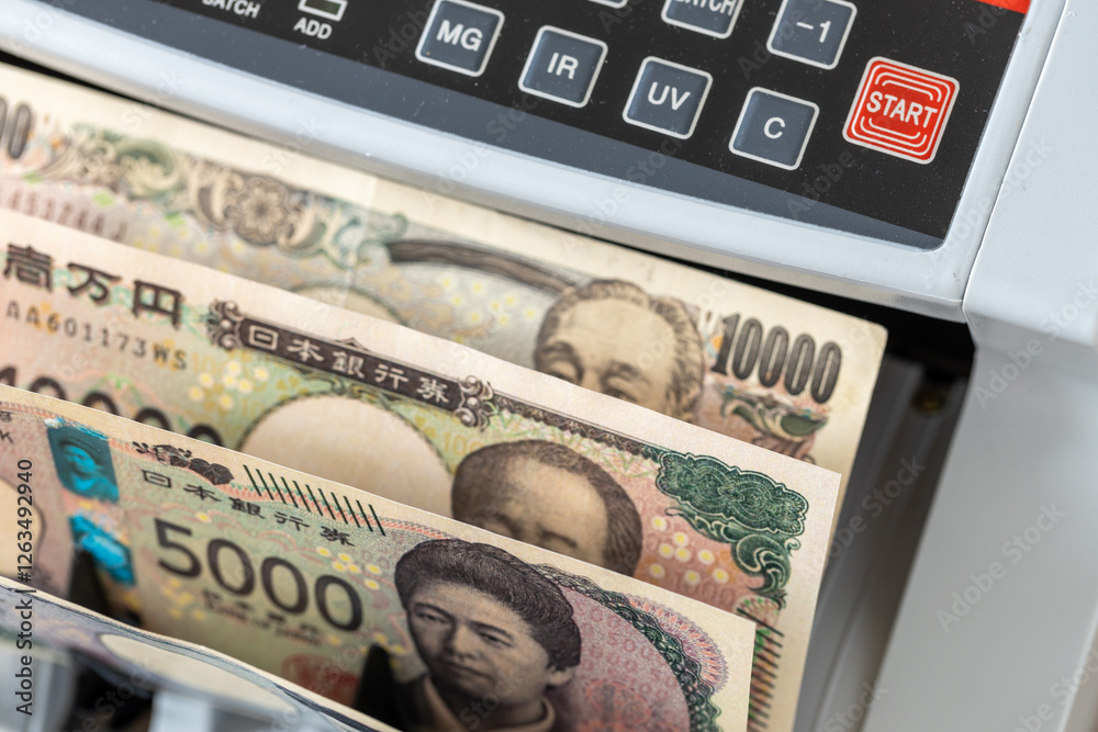 Japan money. Machine counts Japanese yen. Business and financial concept. close up