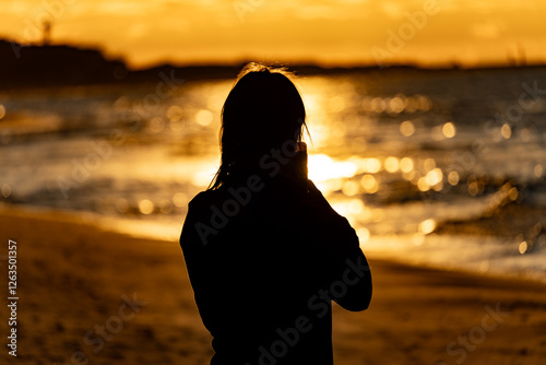 woman at sunset on the beach