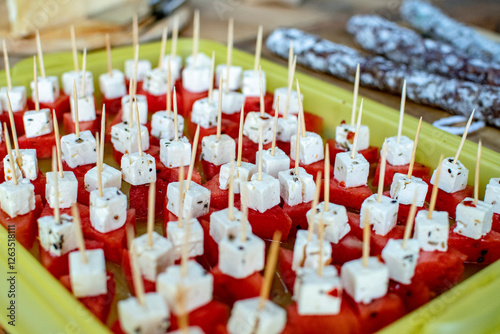 Tomato mozzarella with toothpicks on a platter prepared for the party