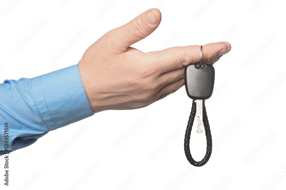 Man with car key and keychain on white background, closeup