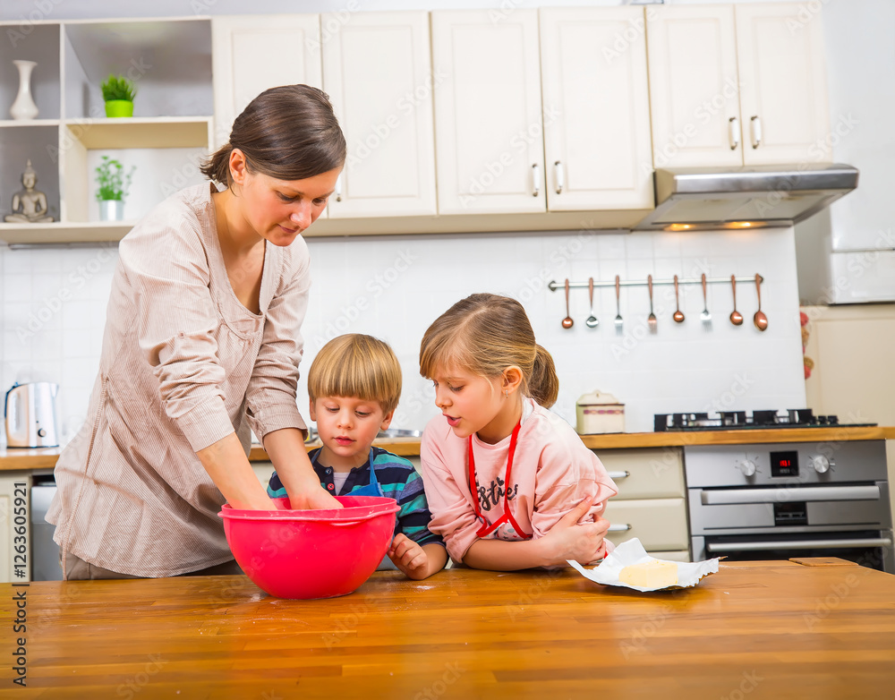 Mother Baking with Kids While Making Cookie Dough in Kitchen Mother Baking with Kids While Making Cookie Dough in Kitchen