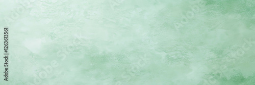 Elegant light mint green wall featuring subtle texture and soft grunge patterns