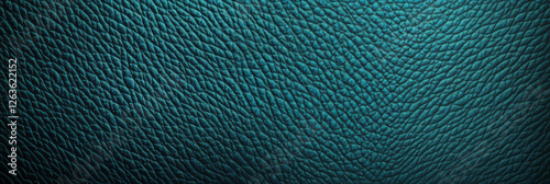 Textured teal blue leather background with visible pores and coarseness for creative use