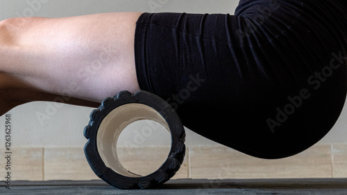 Black MFR roller for body. Recovery massage. MFR roll for rehabilitation and health. Sports equipment. photo