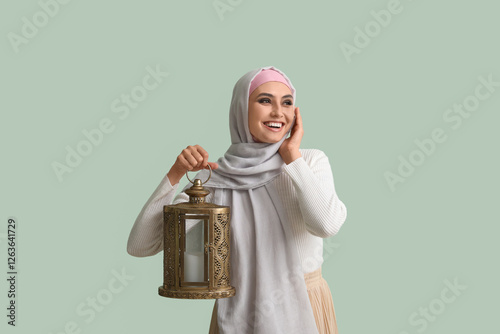 Young Muslim woman with lan...