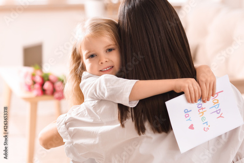 Little girl hugging her mot...