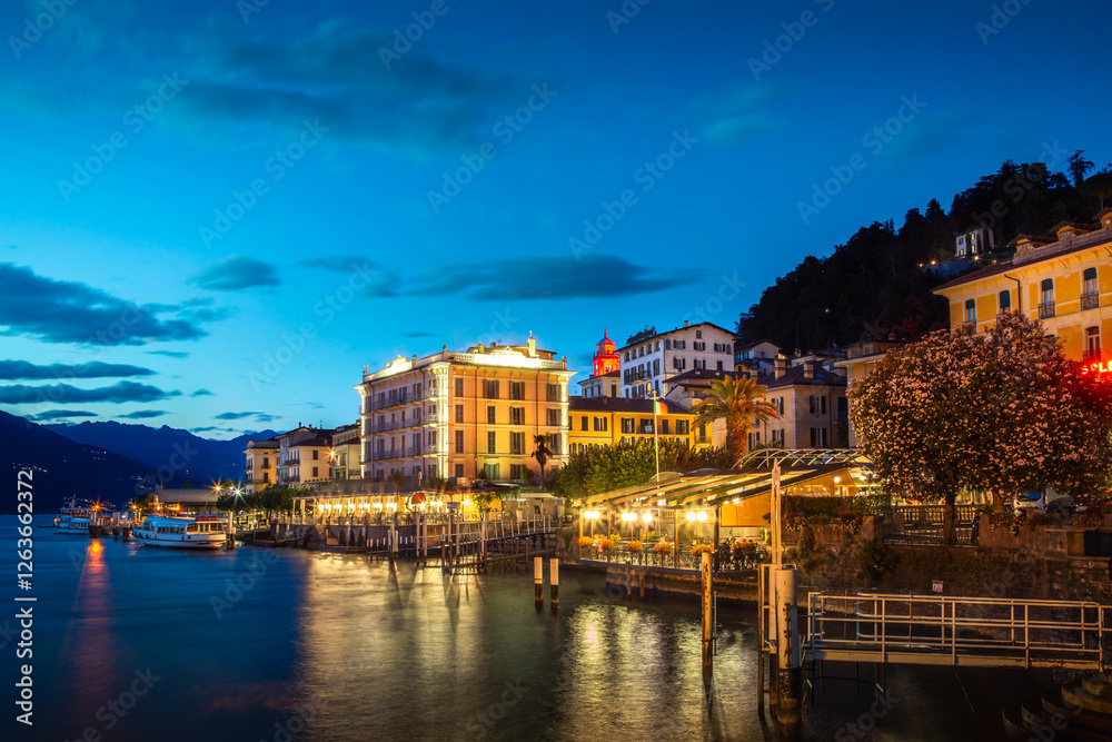 Evening lights reflect on the tranquil waters of Lake Como, highlighting the charming architecture of Bellagio. The scene captures the vibrant ambiance of Bellagio at night Evening lights reflect on the tranquil waters of Lake Como, highlighting the charming architecture of Bellagio. The scene captures the vibrant ambiance of Bellagio at night