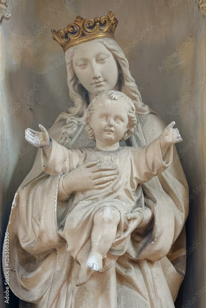 Statue (19th century) of Blessed Virgin Mary holding baby Jesus Christ in her arms. . Statue (19th century) of Blessed Virgin Mary holding baby Jesus Christ in her arms. .