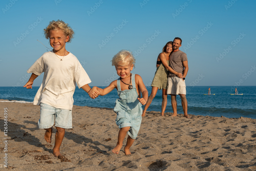 Children Running on the Beach with Parents Watching Children Running on the Beach with Parents Watching
