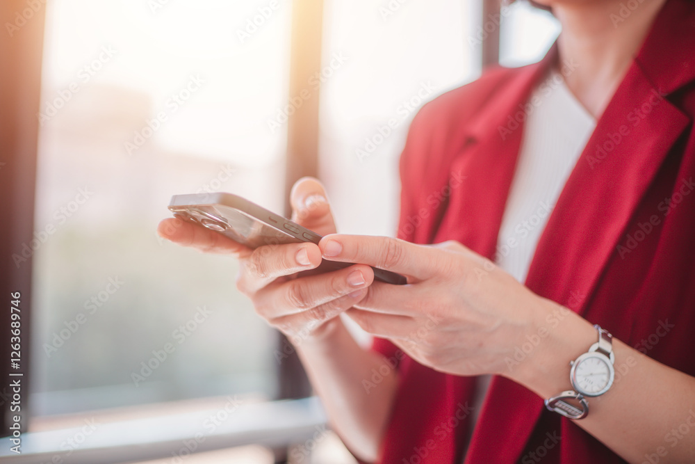 Business woman standing at the window using a smartphone to discuss business investment projects, online networking, meetings, planning, corporate leaders
Business woman standing at the window using a smartphone to discuss business investment projects, online networking, meetings, planning, corporate leaders