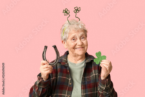 Senior woman in headband wi...